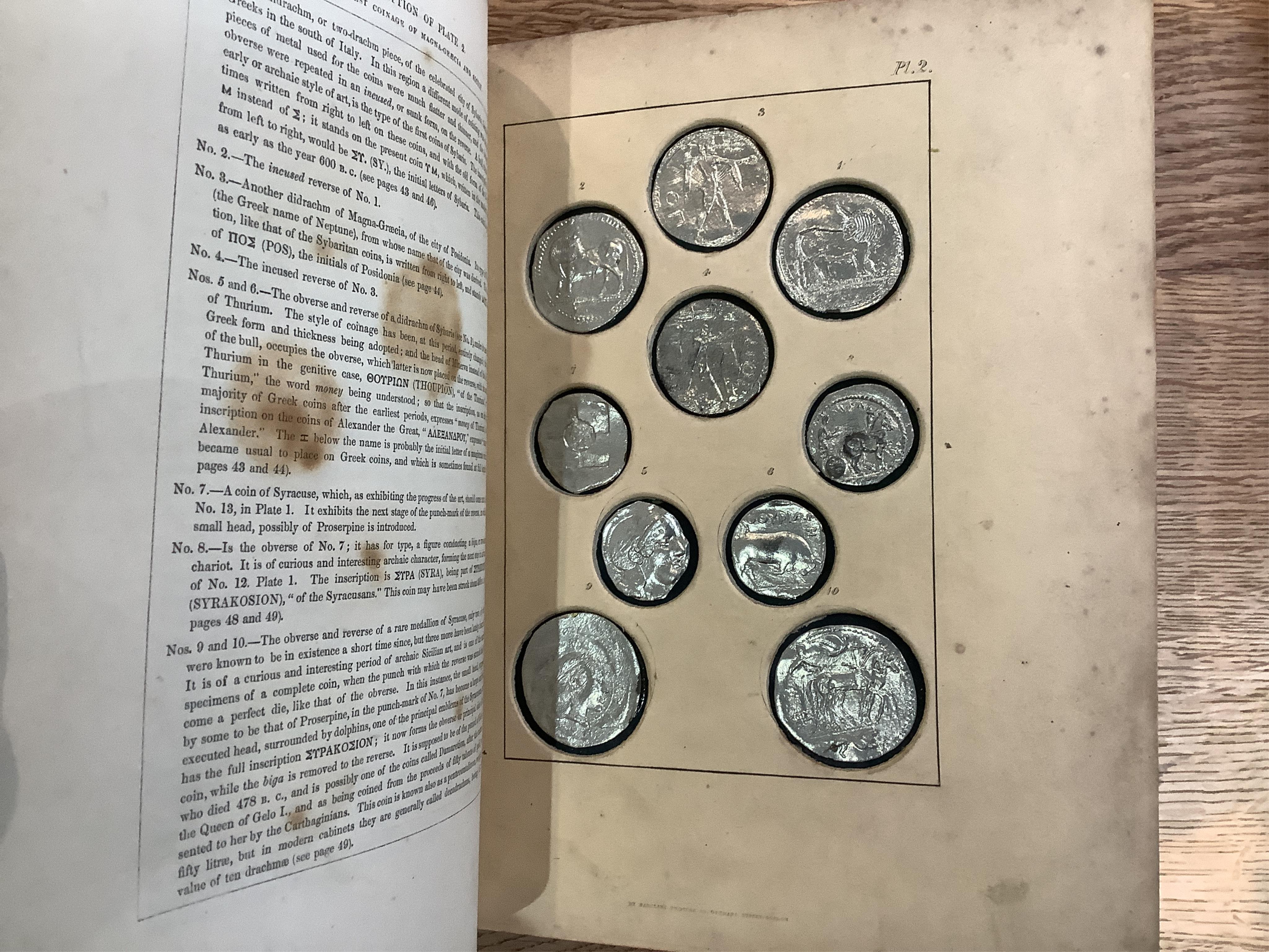 Humphreys, Henry Noel. Ancient Coins and Medals. London: Grant and Griffith, 1850. Octavo, original elaborately embossed full brown calf, marbled endpapers with 114 relief facsimiles of coins and medals on ten thick moun